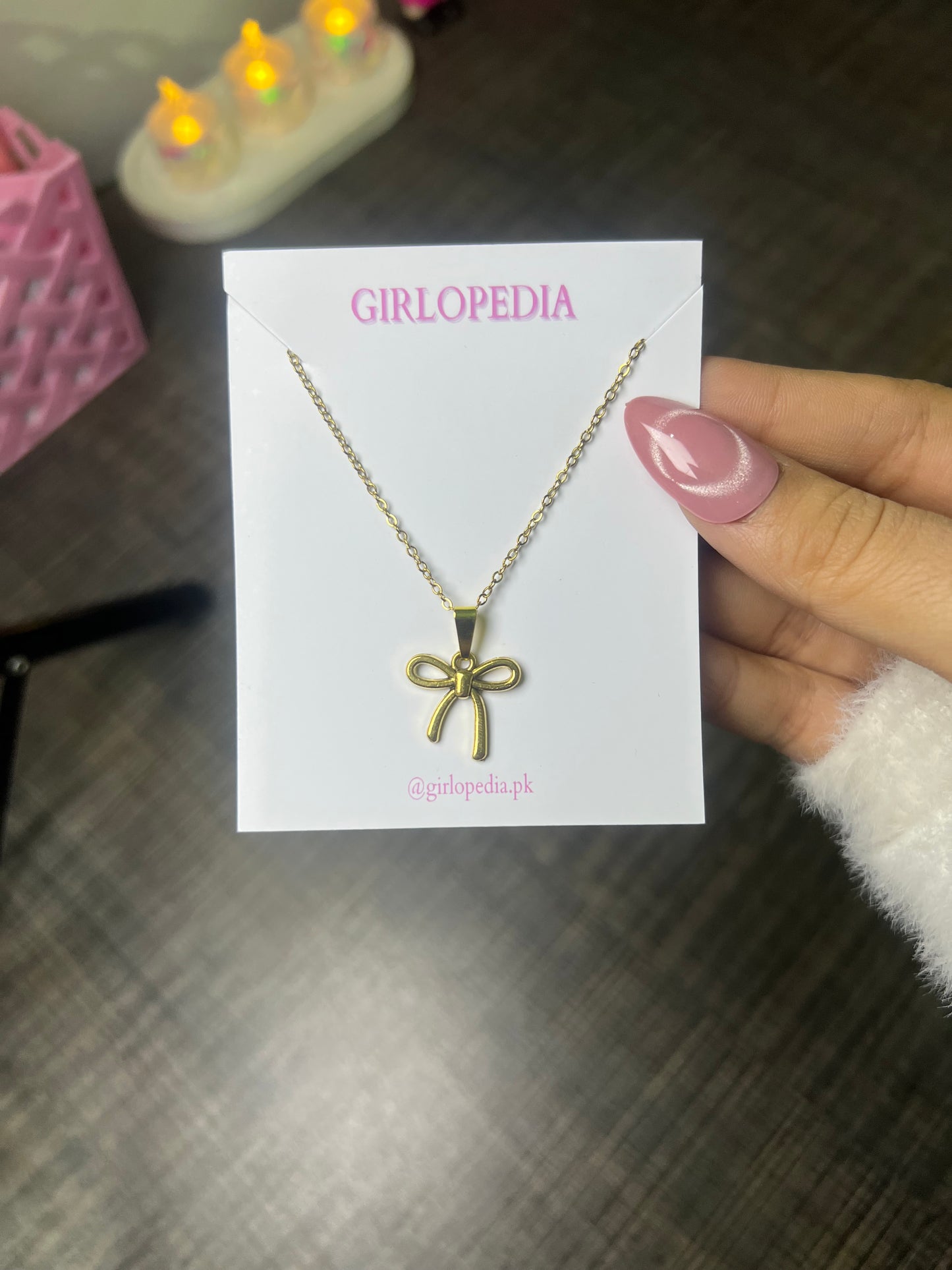 Stainless bow pendant chain