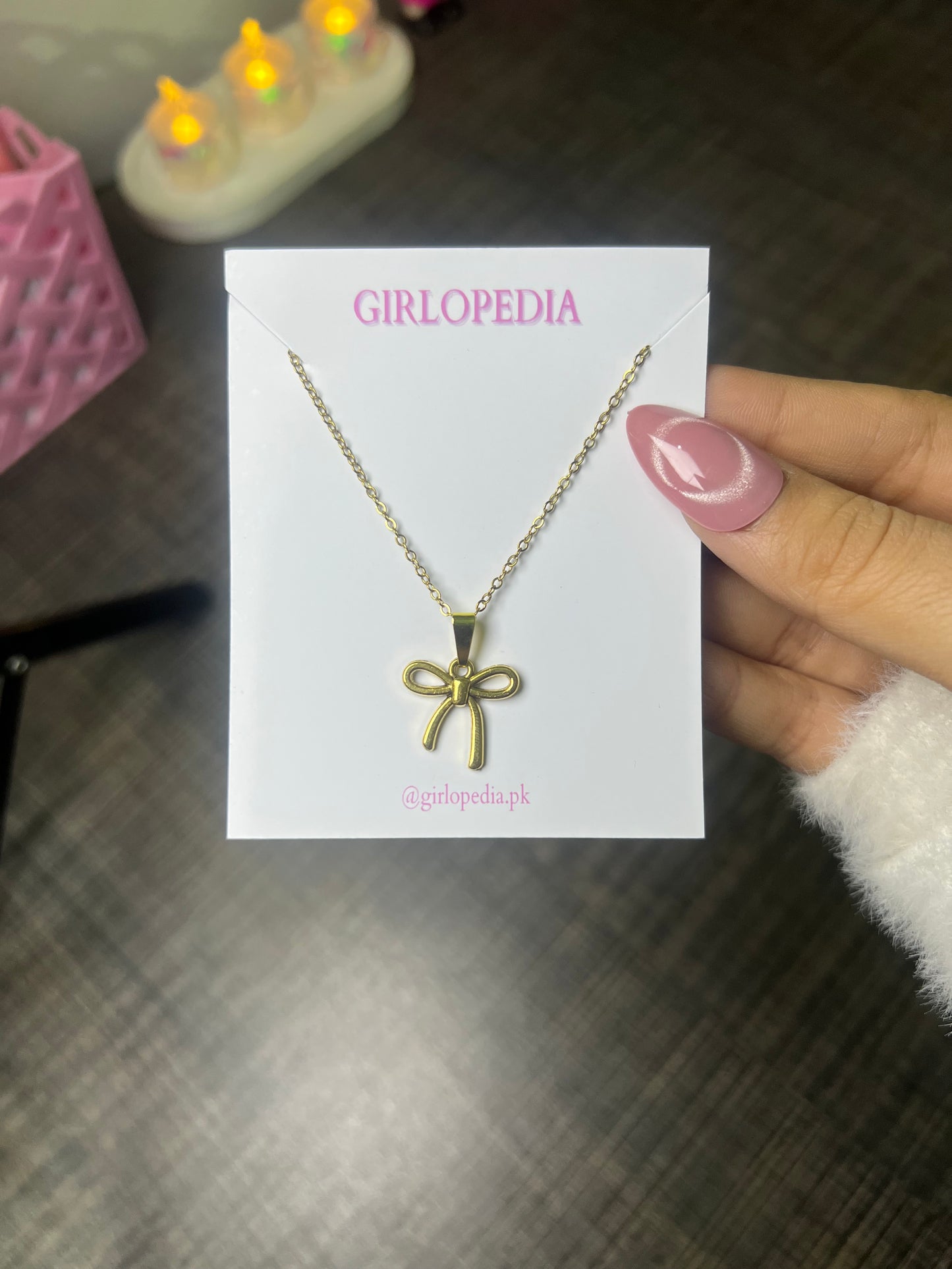 Stainless bow pendant chain