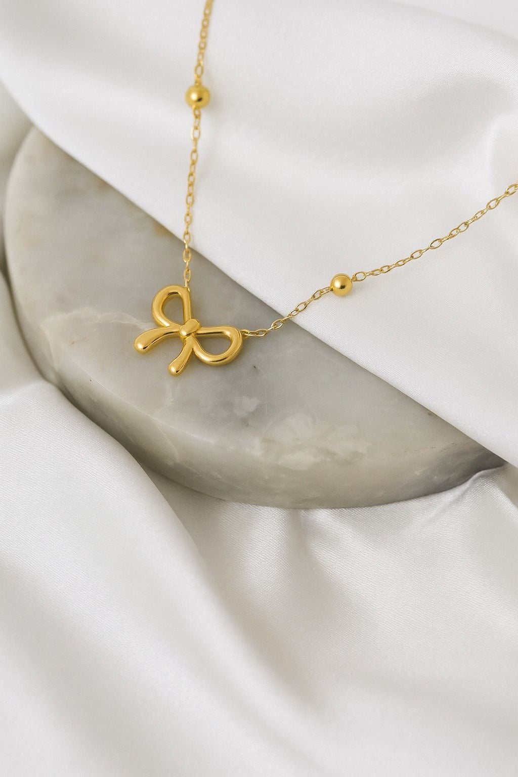Stainless steel high quality minimal golden bow pendant